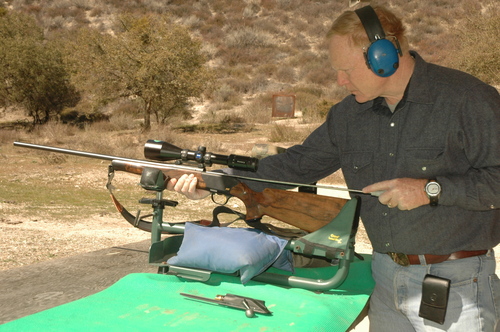 cleaning a rifle on a benchrest